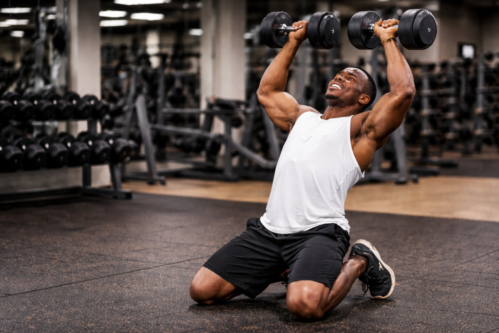 Kneeling-dumbbell-shoulder-press-with-poor-form