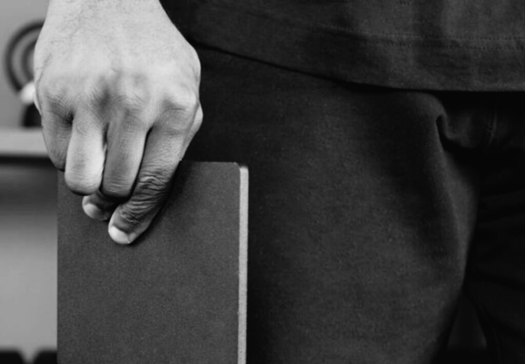 Close-up-of-hand-performing-book-pinches-for-grip-strength-exercise