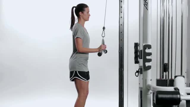 Woman-performing-v-bar-tricep-pushdown