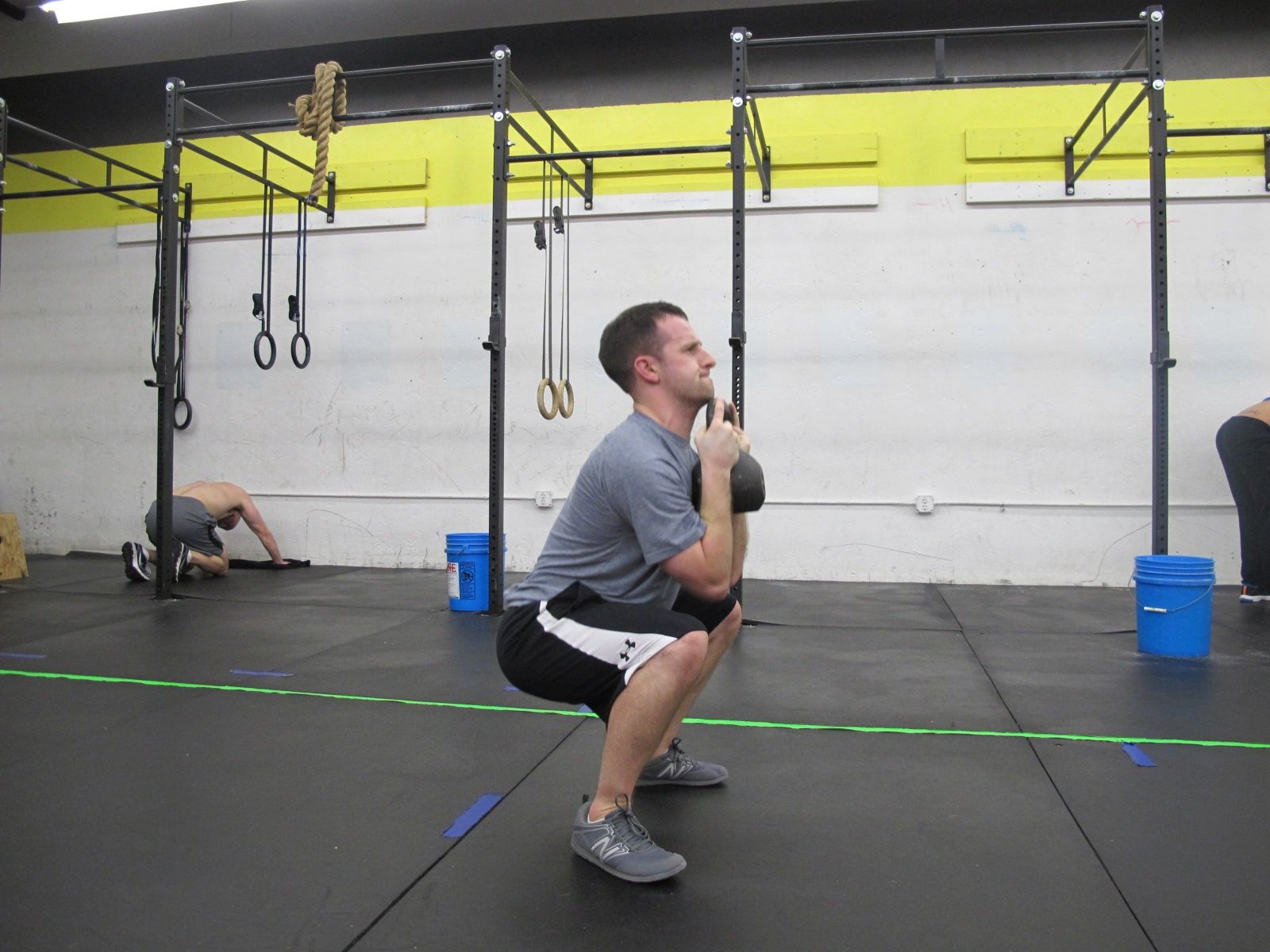 Man-doing-a-goblet-squat