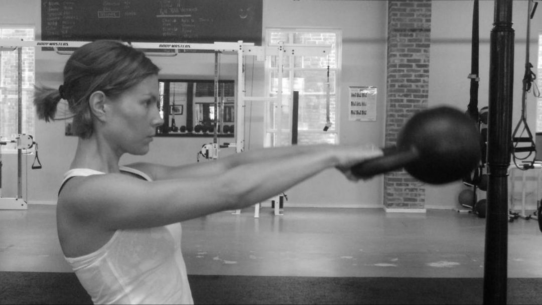 Woman-kettlebell-swing-gym-training