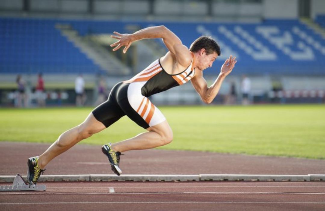 Male-sprinter-starting-from-blocks-on-a-track