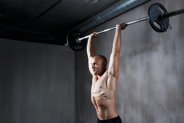Explosive-training-power-muscle-recruitment-barbell-overhead-press-gym-setting