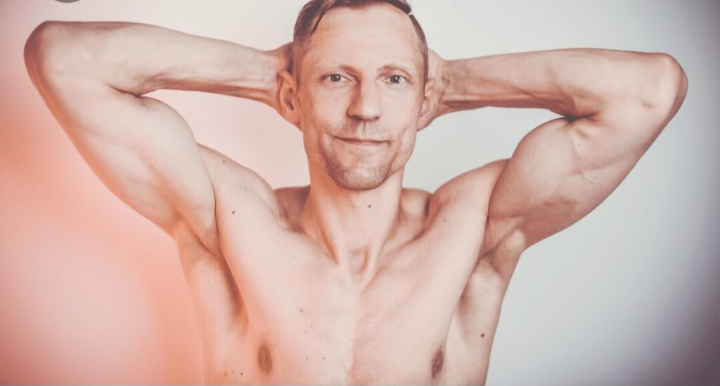 Lean-man-flexing-arms-showing-muscle-imbalances