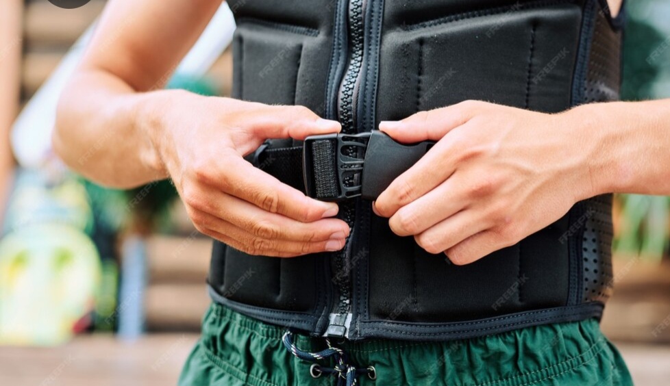 Athlete-tightening-a-weighted-vest-before-workout
