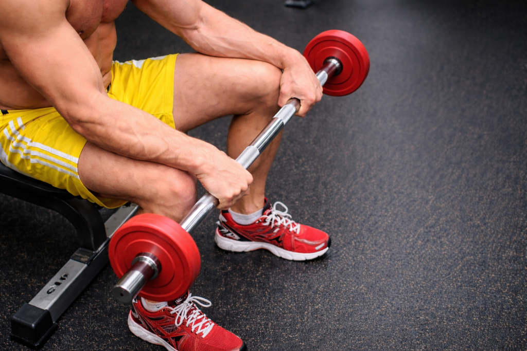 Seated-reverse-wrist-curl-barbell-forearm-exercise
