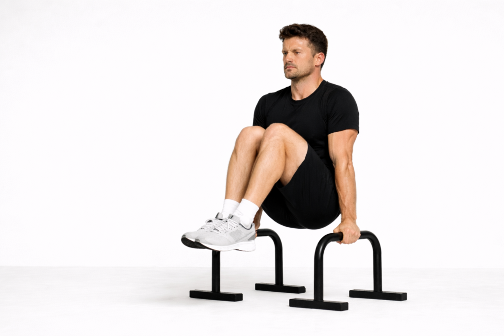 Tuck-hold-with-knees-to-chest-on-parallel-bars